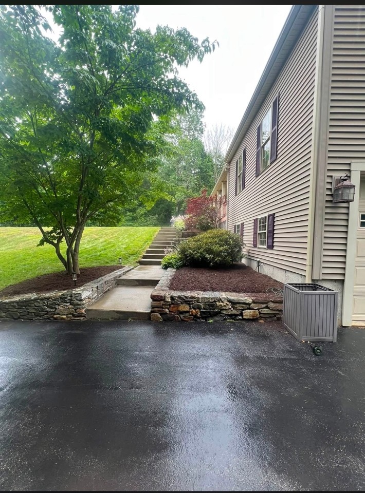 Stone wall and planting beds